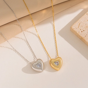 Minimalist heart pendant necklaces in gold and silver steel with crystal details