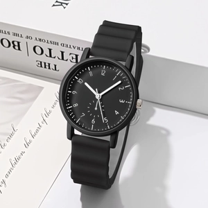 Detail of wavy silicone strap and black dial with white numerals on minimalist sports watch