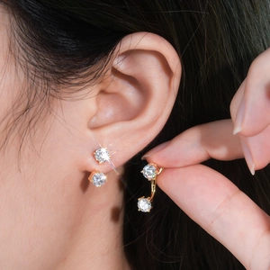 Elegant gold S925 sterling silver moissanite stud earrings shown on model ear