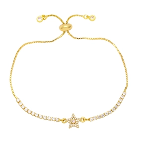 Macro shot of adjustable gold star bracelet with cubic zirconia and slide buckle closure