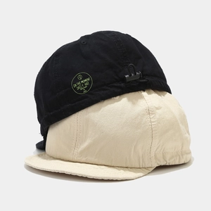 Retro washed cotton baseball cap in black and beige with adjustable drawstring toggle