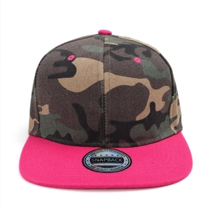 Detail of woodland camouflage baseball cap with vibrant pink brim and snapback sticker