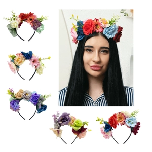 Close-up of artificial rose floral headbands and corsages in multiple vibrant colors