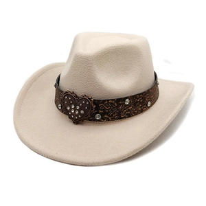 Detail of beige felt cowboy hat with embossed leather band and studded heart buckle
