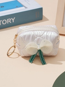 Quilted white bow coin purse with pearl detail and golden keychain accessory