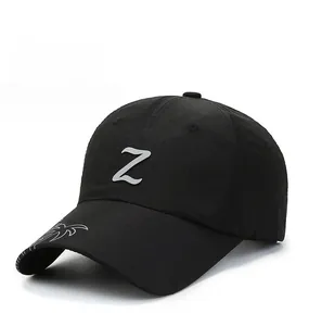 Detail view of black sun hat featuring 3D silver Z logo and white wave embroidery