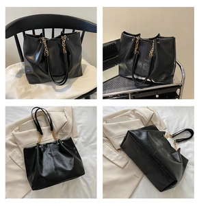Détail du sac cabas noir avec chaîne dorée et texture en similicuir souple de qualité