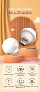 Macro shot of a white spherical USB LED night light with voice control on 3D orange podium