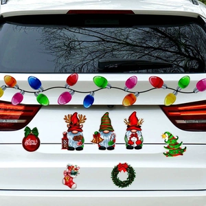 Car trunk decorated with reflective Christmas gnome magnets and colorful bulb decals
