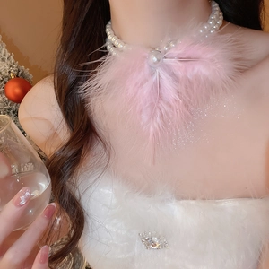 Detailed view of elegant double-layered pearl necklace with soft pink feather pendant