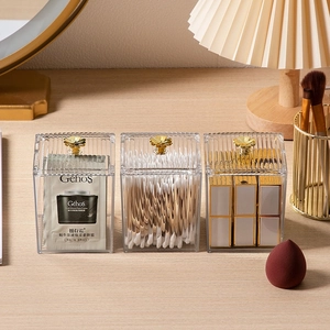 Transparent acrylic storage boxes with gold floral handles for makeup and jewelry