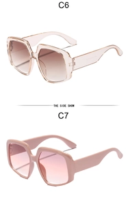 Detailed side view of oversized square sunglasses in champagne and dusty pink frames