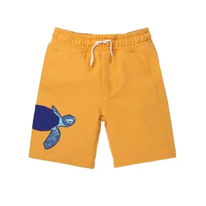 Kids bright yellow cotton shorts with navy sea turtle embroidery and drawstring waist