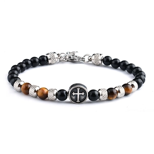 Detail of cross charm on vintage 6mm tiger eye and black beaded bracelet for men