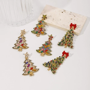 Detailed top view of Christmas tree earrings with colorful rhinestones and pearls on white
