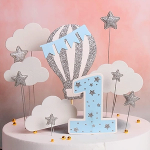 Detailed set of blue hot air balloon, glitter stars and cloud cake toppers for first birthday