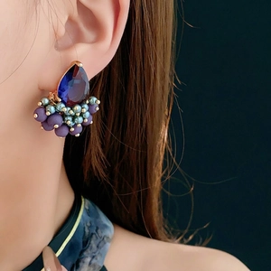 Chic silver needle earrings with teardrop blue crystal and purple beaded accents