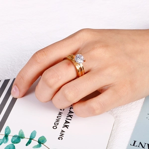 Minimalist gold titanium steel ring with a sparkling solitaire zircon in a layered design