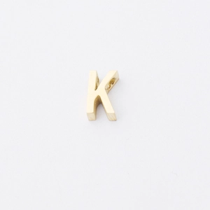 Detailed view of polished gold stainless steel letter K bead charm with 1.8mm small hole
