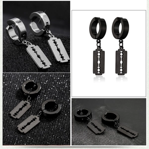 Detail view of silver and black punk blade pendant earrings in stainless steel