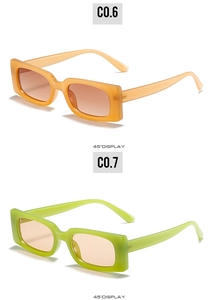 Detail view of vintage rectangle sunglasses in amber and neon green transparent frames