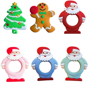 Set of 6 Christmas silicone baby teethers featuring Santa, gingerbread man and tree designs