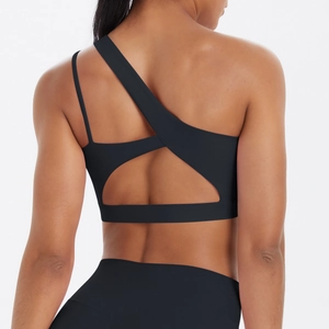 Detail view of black yoga bra with asymmetric cutout back and single thin shoulder strap