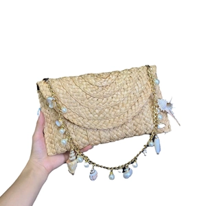 Handmade woven beach bag with seashells, pearls and gold chain strap for women