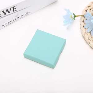 Detail view of square Tiffany blue jewelry gift box with textured orange peel finish
