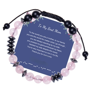 Detail of Morse code bracelet with pink quartz beads and message card for sister