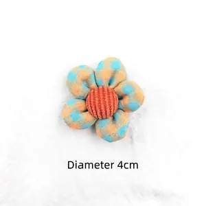 Detailed view of a 4cm blue and orange checkered fabric flower for DIY hair accessories