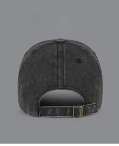 Detail view of adjustable metal buckle and washed denim texture on baseball cap