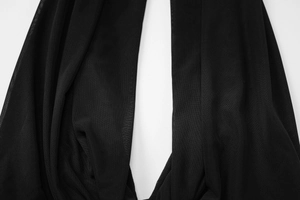 Detailed close-up showing the breathable black mesh fabric and sheer texture of the skirt
