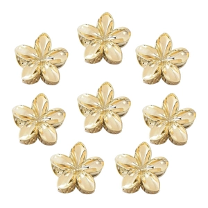 Set di otto mollette per capelli dorate a forma di fiore per acconciature eleganti su fondo bianco