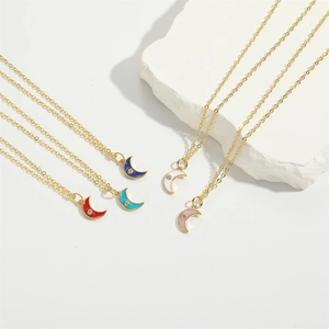 Classic crescent moon pendant necklace set in gold chain with colorful gemstones