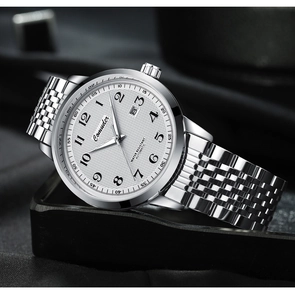 Detailed 45-degree side view of silver mechanical watch with white textured dial