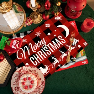 Detail of red and black buffalo plaid Christmas placemat with Merry Christmas print and reindeer