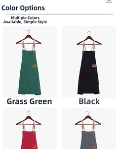 Detail view of canvas apron with leather accents, metal buckles and double front pockets
