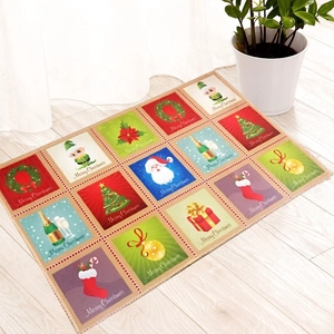 Christmas non-slip floor mat with 16-grid Santa and tree patterns on white floor