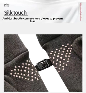 Detail view of winter gloves with anti-slip palm dots and convenient anti-lost buckle