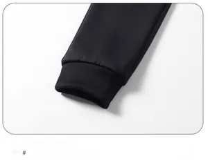 Detailed close-up of high-elastic ribbed cuffs on men's black drawstring joggers