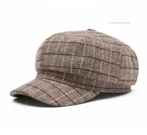 Detail shot of the khaki vintage plaid woolen octagonal hat showing the fabric texture