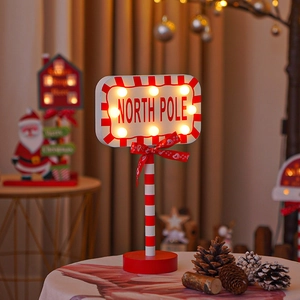 LED Christmas North Pole sign table lamp with warm lights and festive red ribbon decor