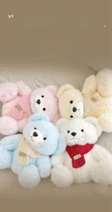 Close-up of four fluffy teddy bears with colorful knitted scarves in high-density plush
