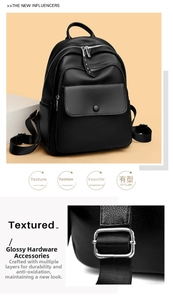Detail of lychee pattern leather and silver hardware on a black women backpack