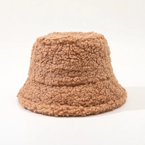 Close-up of fluffy brown sherpa fleece texture on a warm winter bucket hat
