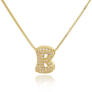 Macro detail of gold letter B pendant with cubic zirconia pavé and sleek box chain