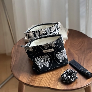 Linen canvas cosmetic bag with white butterfly embroidery and zipper closure set