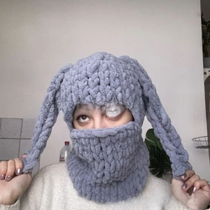 Detailed knit texture of dark gray rabbit ear Balaclava hat with integrated neck warmer