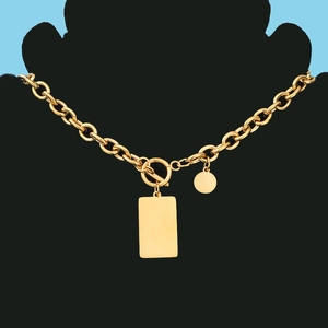 Detail of gold OT buckle chain necklace with square and round pendants on mannequin